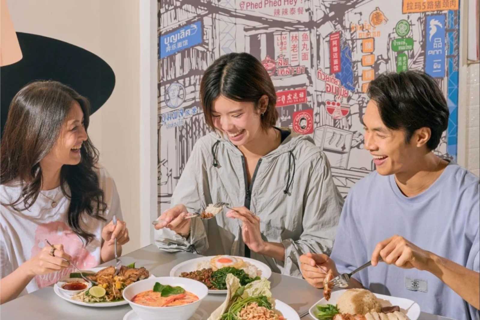 Friends Enjoying Thai Food at a Bangkok Restaurant