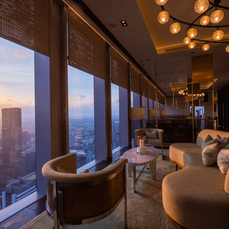 Luxury Lounge with Curved Sofa and Sunset View