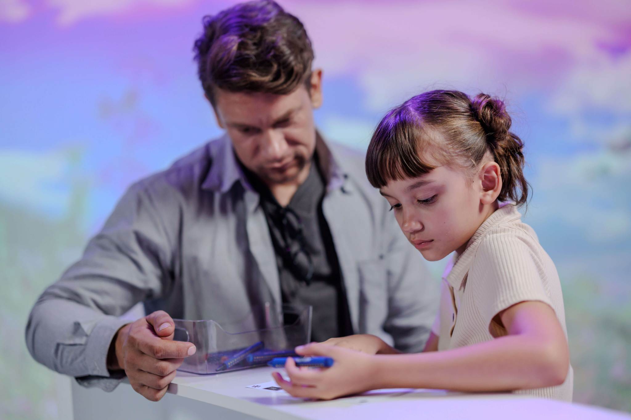 Father and Daughter Drawing at Interactive Exhibit