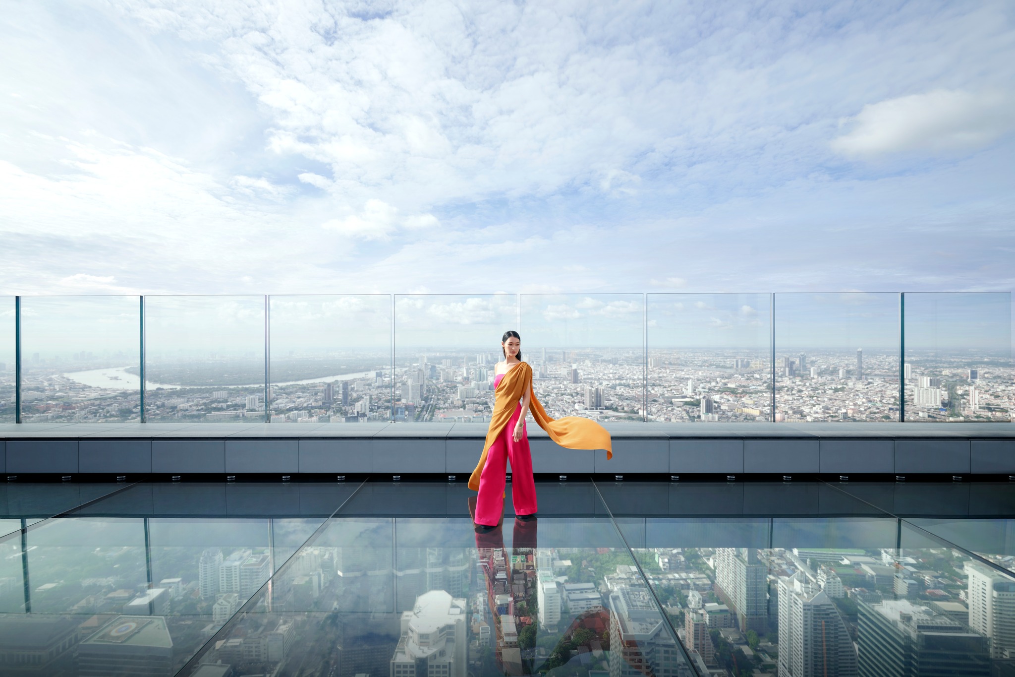 Woman Standing on Glass Skywalk Overlooking Bangkok Woman Standing on Glass Skywalk Overlooking Bangkok