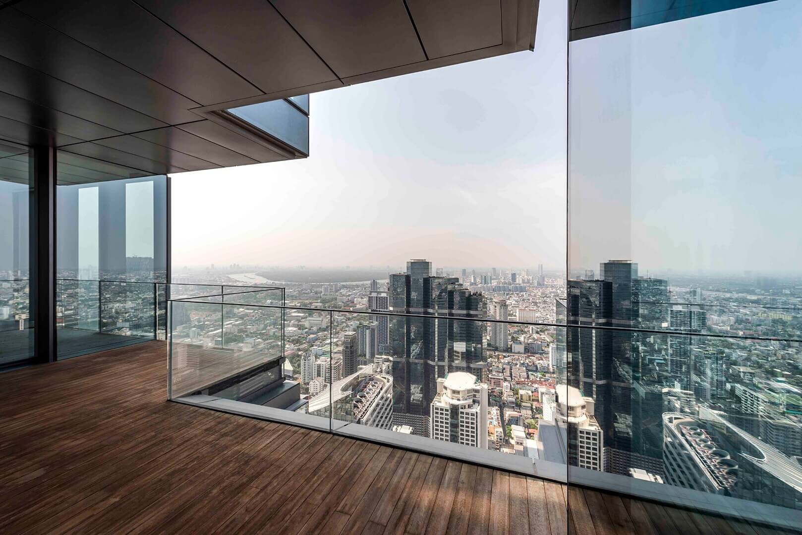 Penthouse Terrace with Wooden Deck and Cityscape View