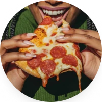 Person Eating Pepperoni Pizza Slice